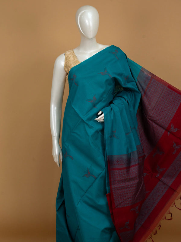 Teal blue pure silk cotton saree with woven bird motifs and contrast red pallu and border
