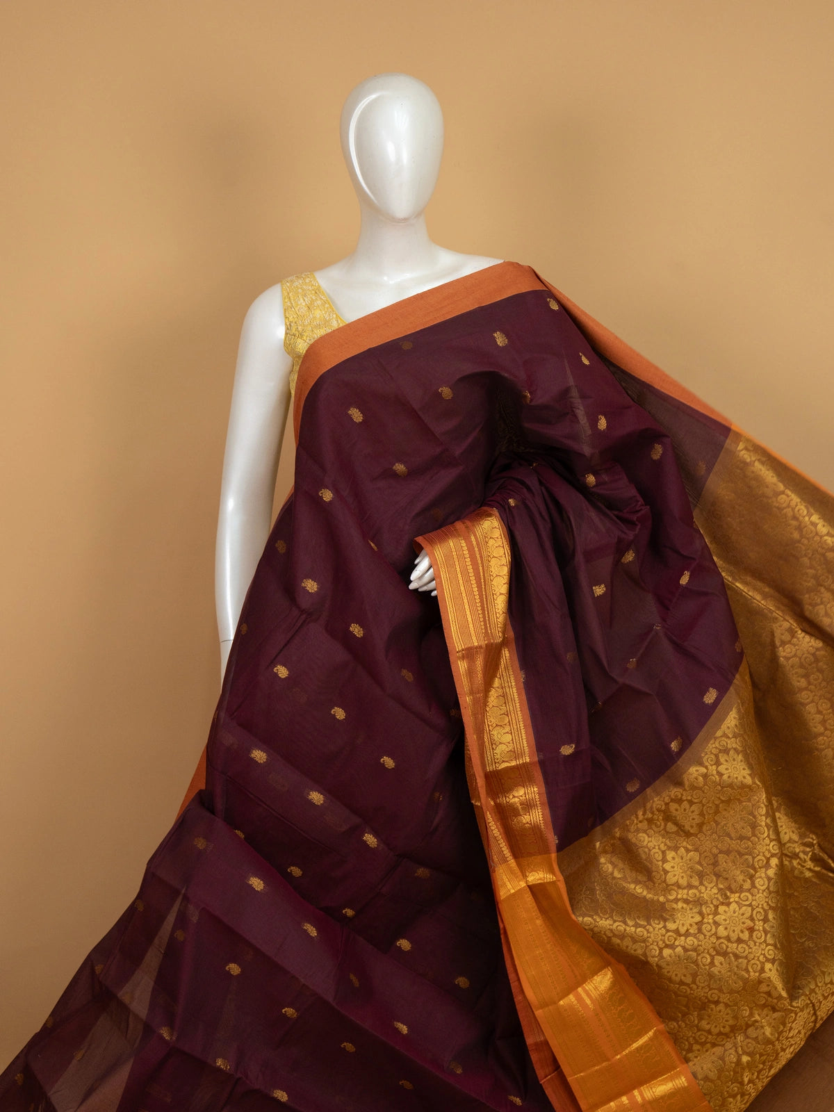 Maroon Chettinad cotton saree with contrast orange gold zari peacock border and zari buttas