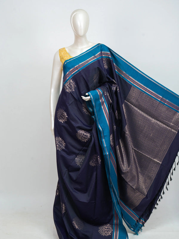 Navy blue Kanchipuram fancy silk saree with peacock blue contrast border and silver zari floral buttas