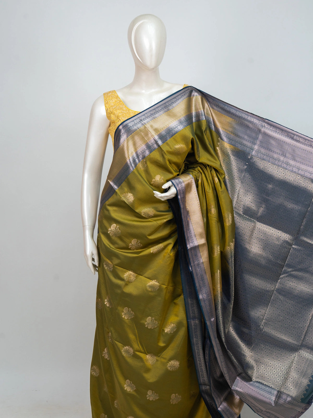 Olive green semi silk saree with teal blue contrast zari border and zari butta motifs