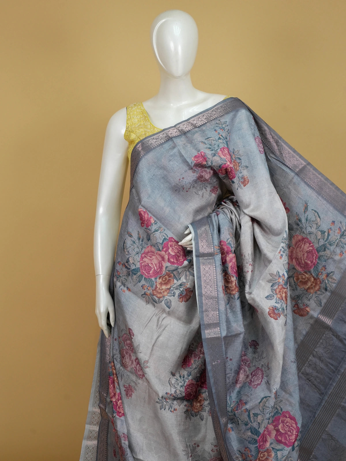 Grey semi tussar saree with pink floral prints and silver zari border