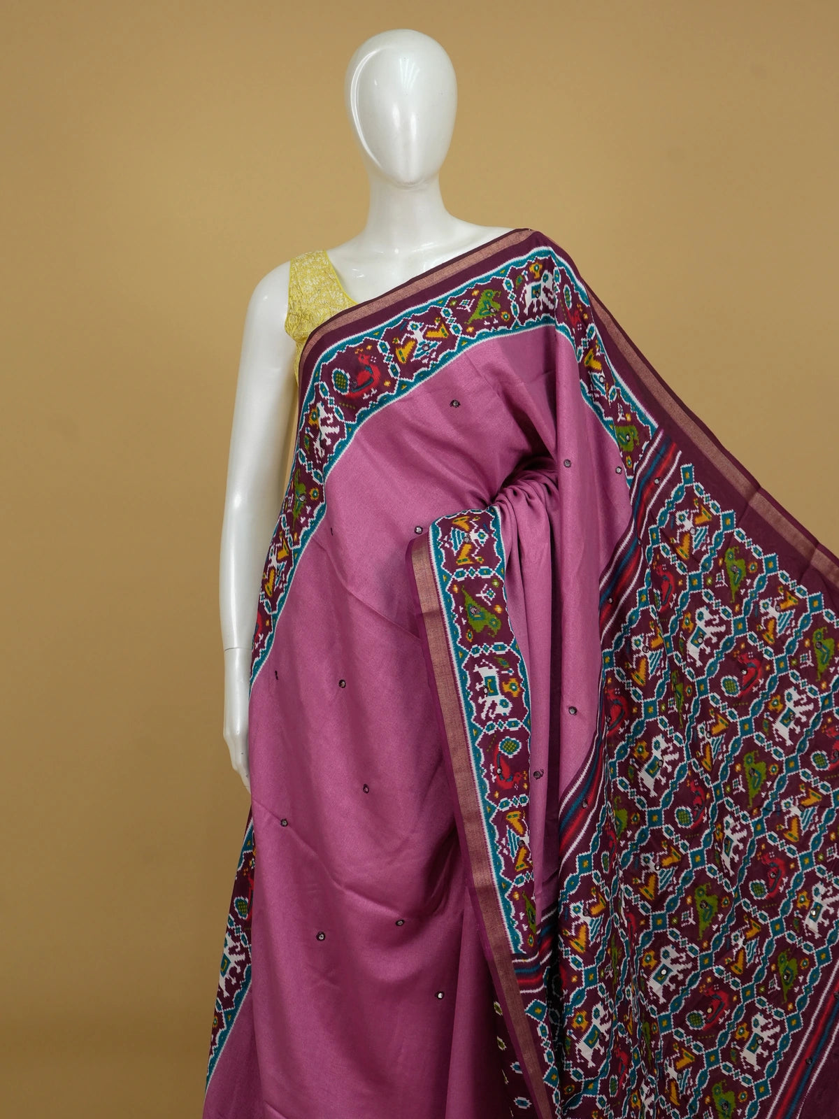 Mauve pink linen cotton saree with contrast maroon patola-print border, mirror work and multicolour ikat pallu