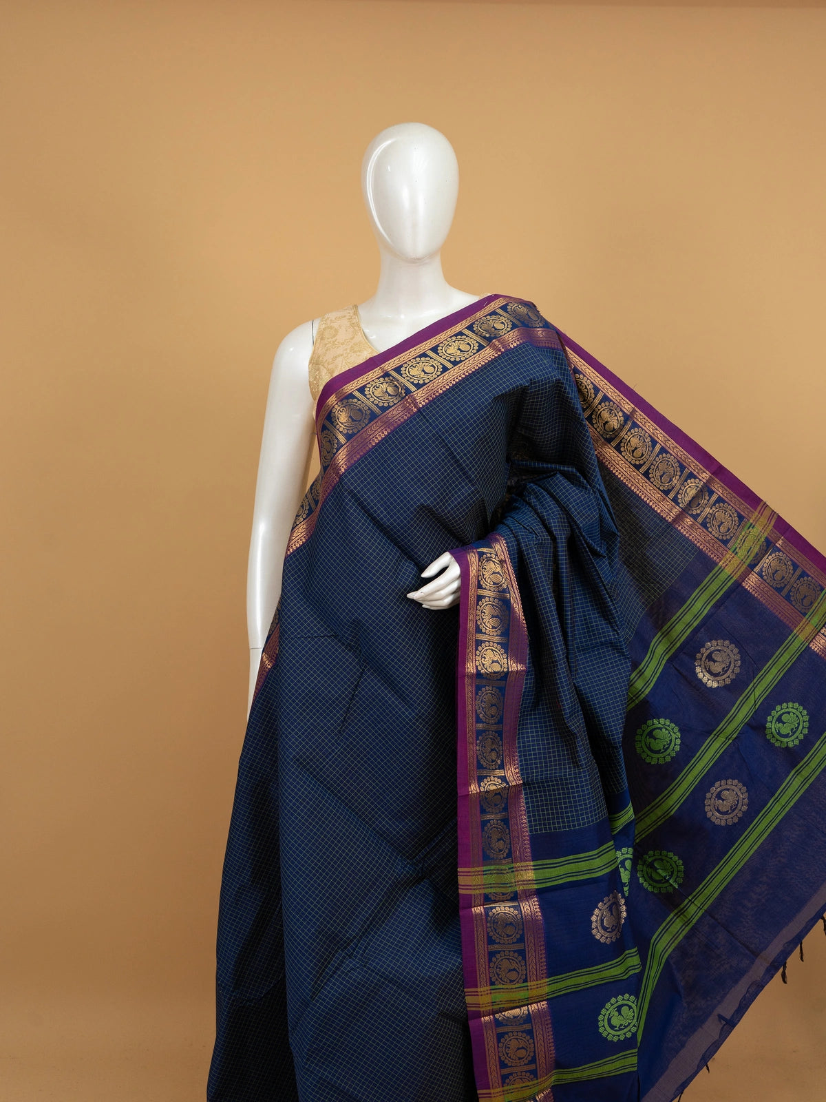 Navy blue Chettinad cotton saree with green checks and magenta gold zari peacock border