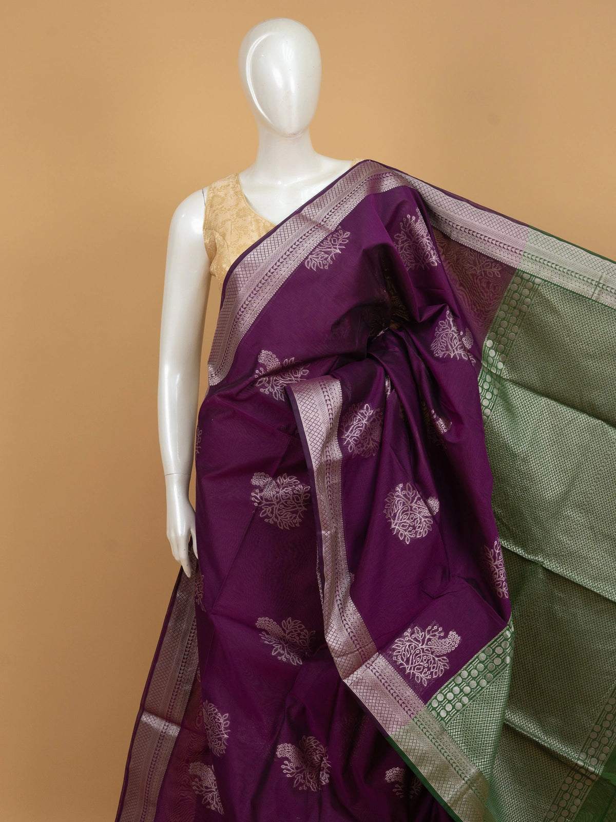 Purple silk cotton saree with silver zari floral buttas and contrast green zari border and pallu