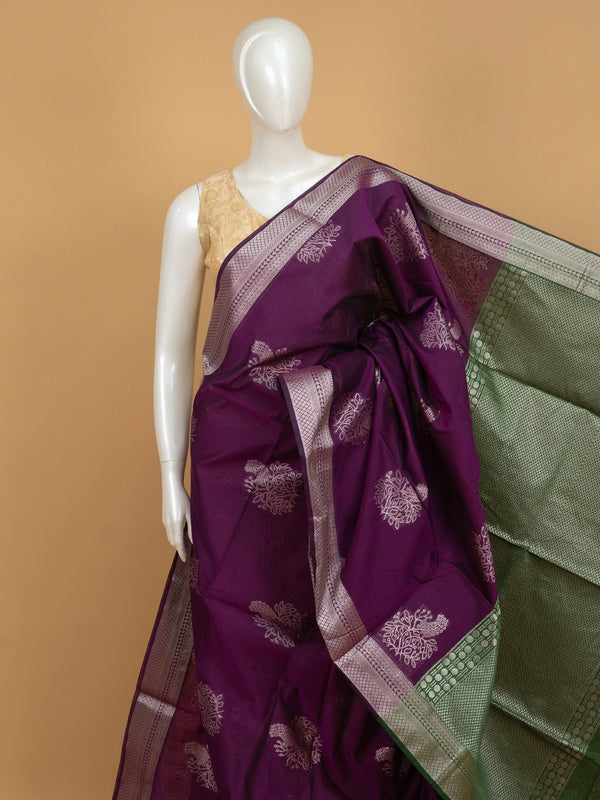Purple silk cotton saree with silver zari floral buttas and contrast green zari border and pallu