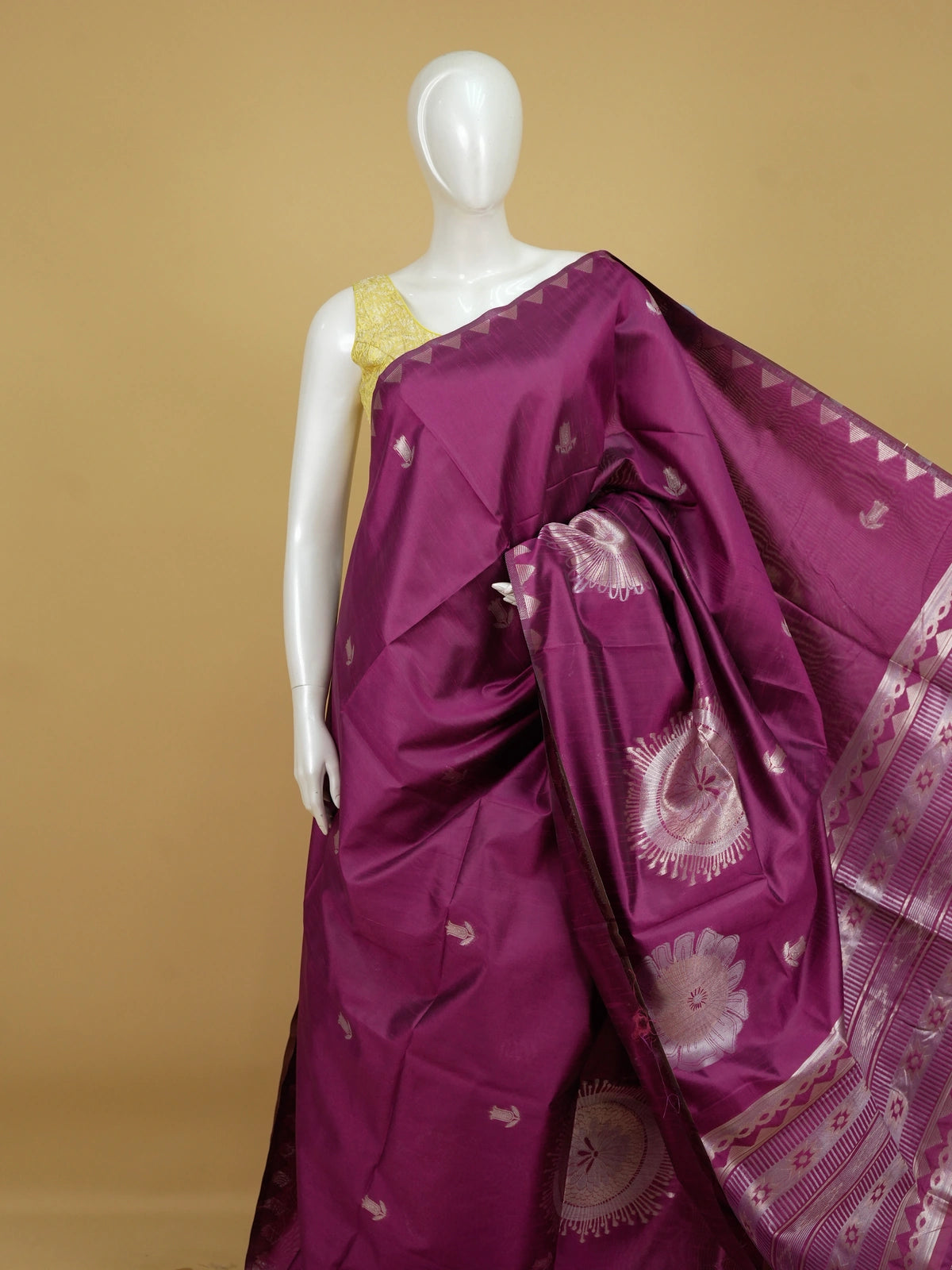 Magenta semi tussar saree with silver floral medallions and temple triangle border