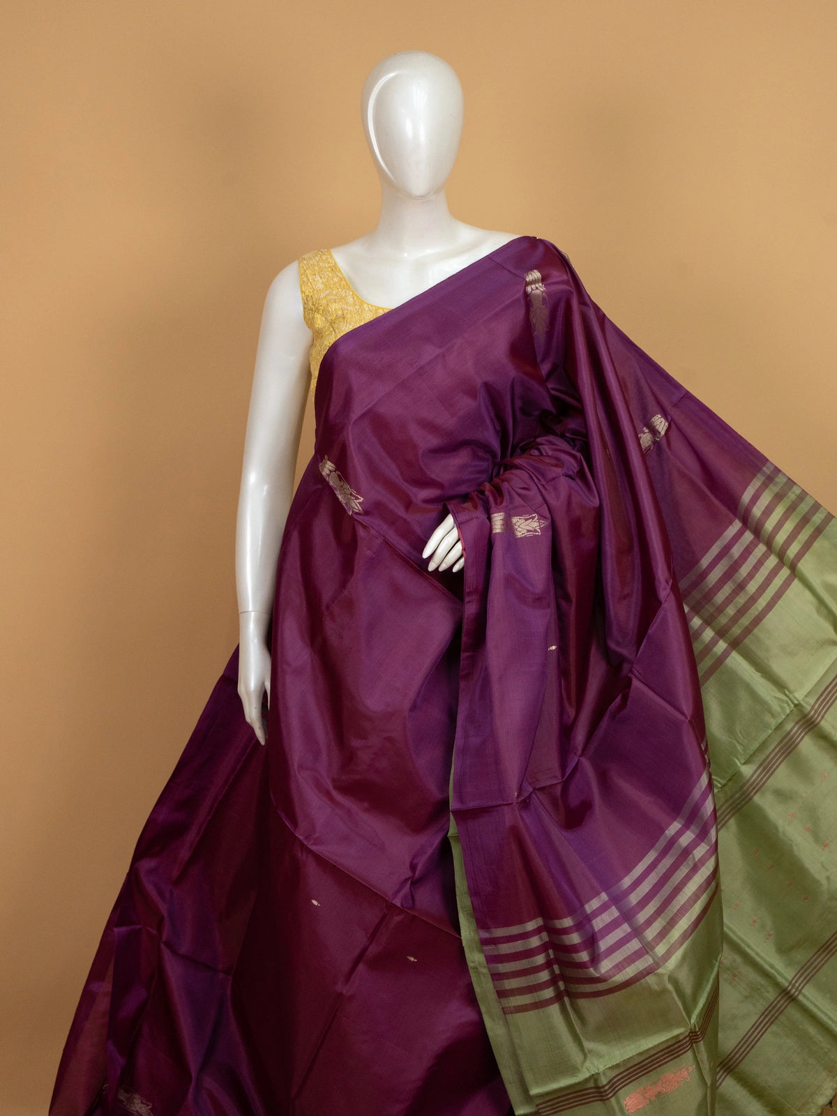 Purple banana silk saree with contrast green zari border and striped pallu