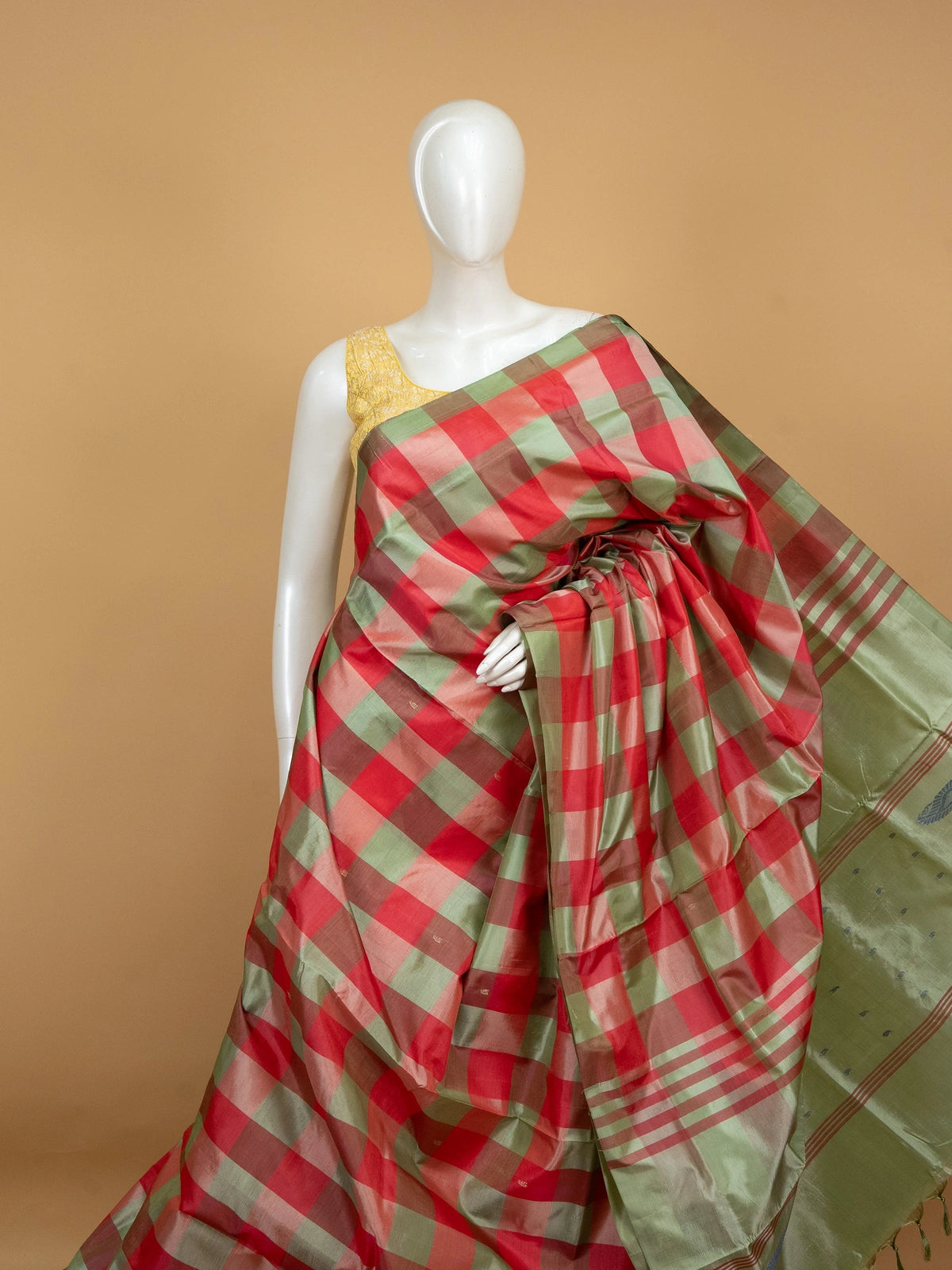 Red and green checked Banana silk saree with contrast light green paisley pallu and zari border