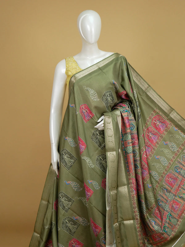 Olive green Dola silk saree with multicolour dancing lady and peacock prints and gold zari border