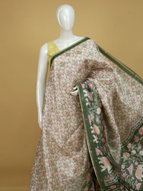 Cream semi tussar saree with floral jaal body, olive green elephant pallu and golden zari border