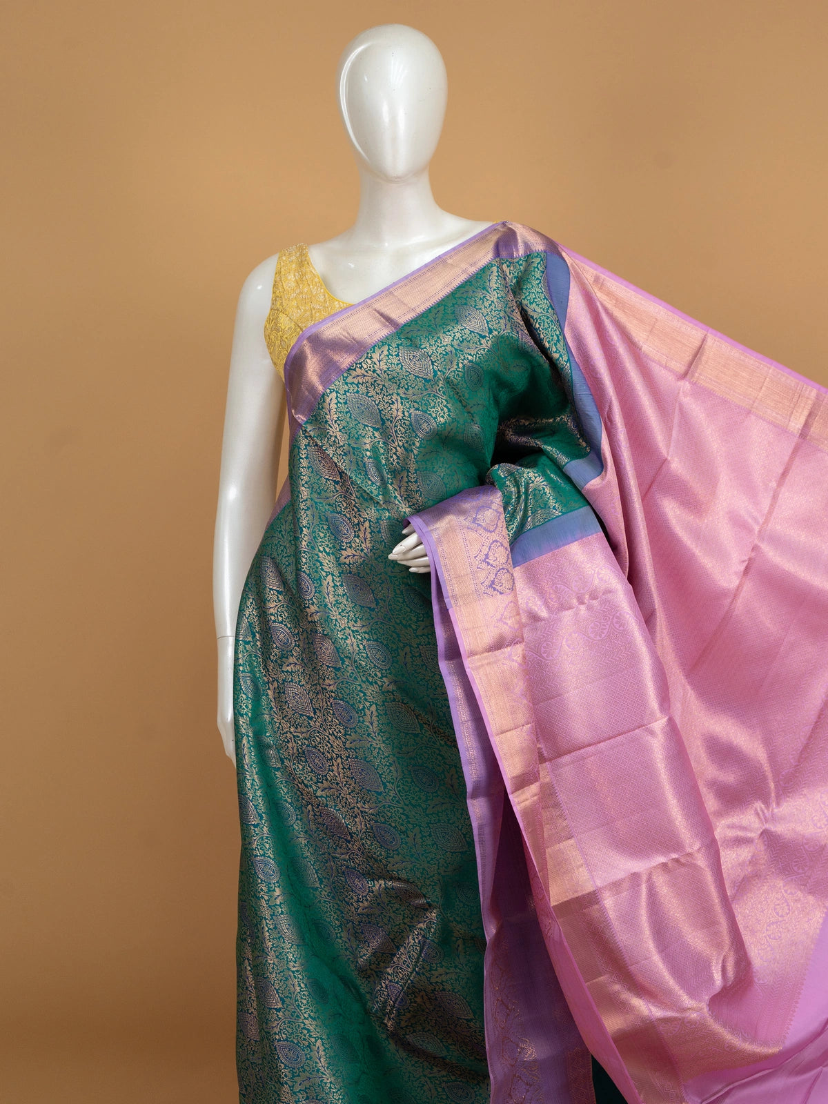 Teal green pure Kanchipuram silk saree with gold zari brocade and contrast lilac pink border and pallu