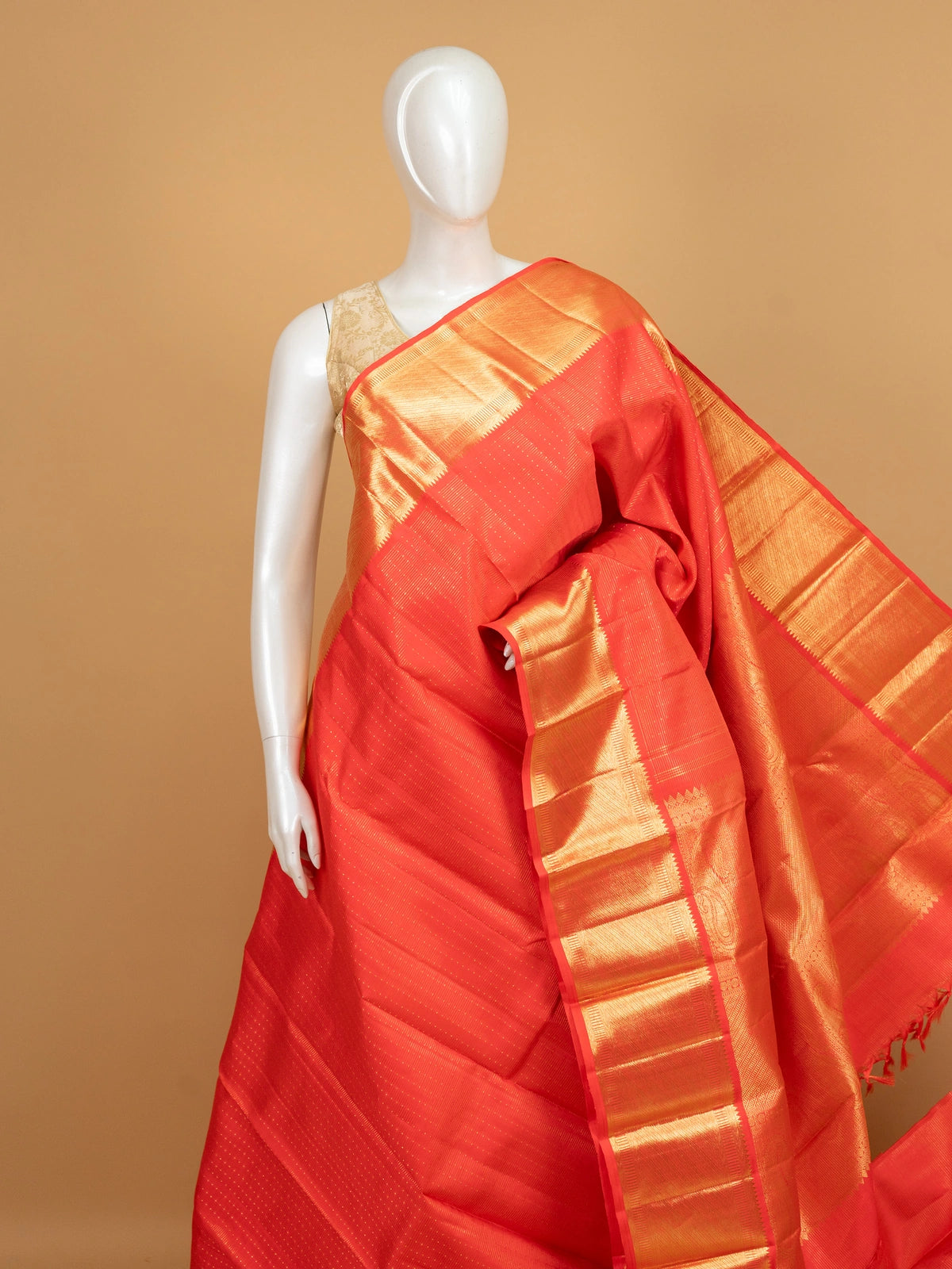 Red pure Kanchipuram silk saree with gold zari buti body, contrast temple-style gold border and paisley zari pallu