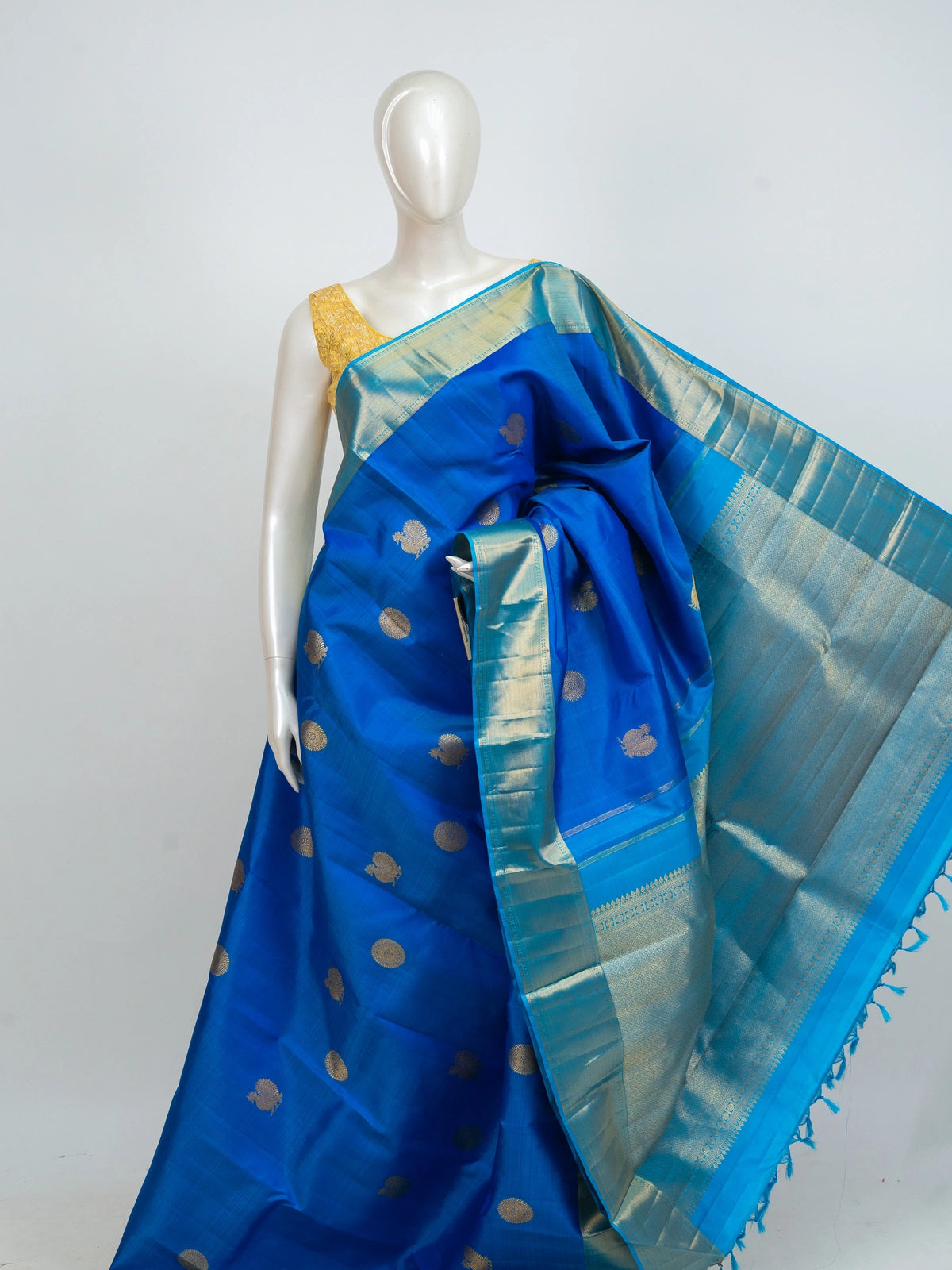 Royal blue pure Kanchipuram silk saree with turquoise and gold zari border and woven peacock motifs