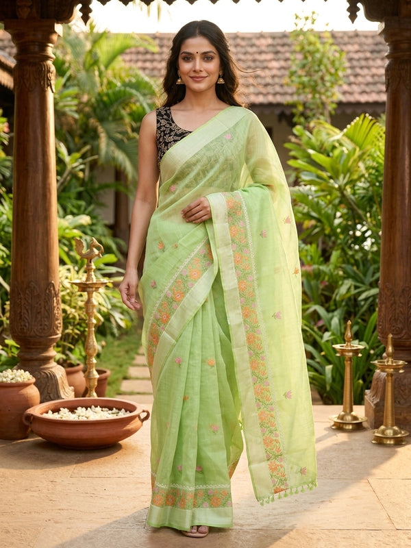Pista green linen cotton saree with pink and orange floral embroidery and silver zari border
