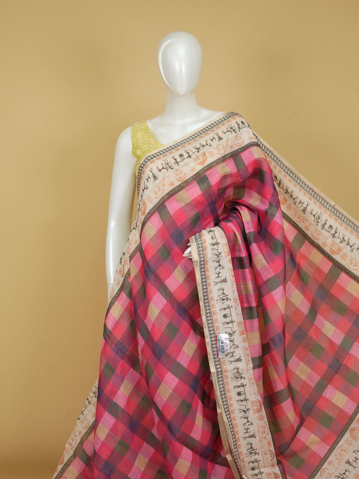 Pink and cream checked linen cotton saree with Warli tribal print border and contrast yellow blouse