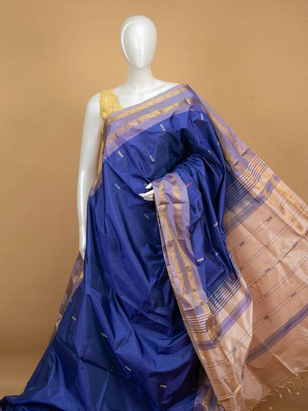 Royal blue banana silk saree with lavender-gold zari border and contrast beige striped pallu