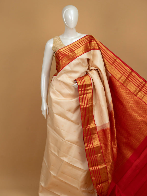 Cream pure Kanchipuram silk saree with contrast red gold zari border and pallu