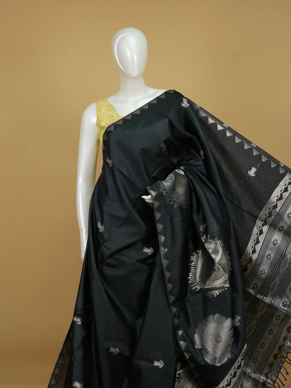 Black semi tussar saree with silver zari floral medallions and temple-design border