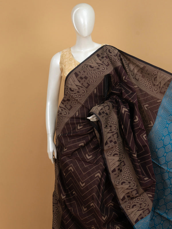 Dark brown silk cotton saree with chevron woven body and contrast peacock blue geometric pallu