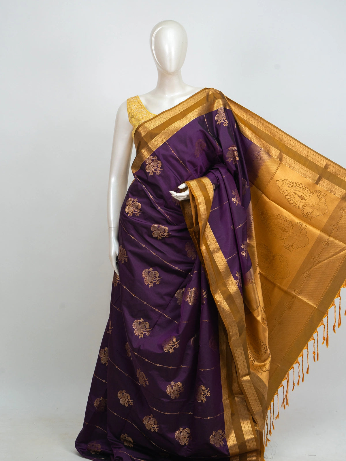 Purple Kanchipuram fancy silk saree with mustard-gold zari border, floral buttas and paisley pallu