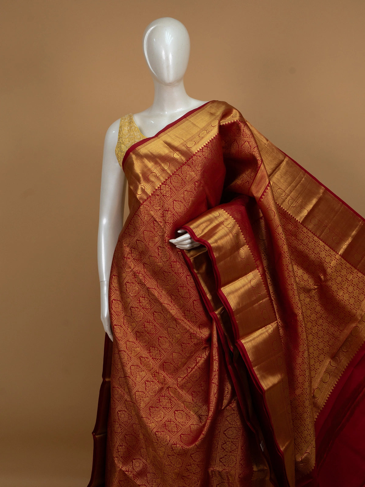 Red pure Kanchipuram silk saree with all-over gold zari brocade and wide contrast gold border