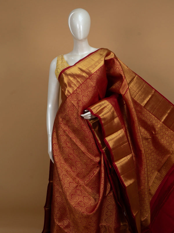 Red pure Kanchipuram silk saree with all-over gold zari brocade and wide contrast gold border