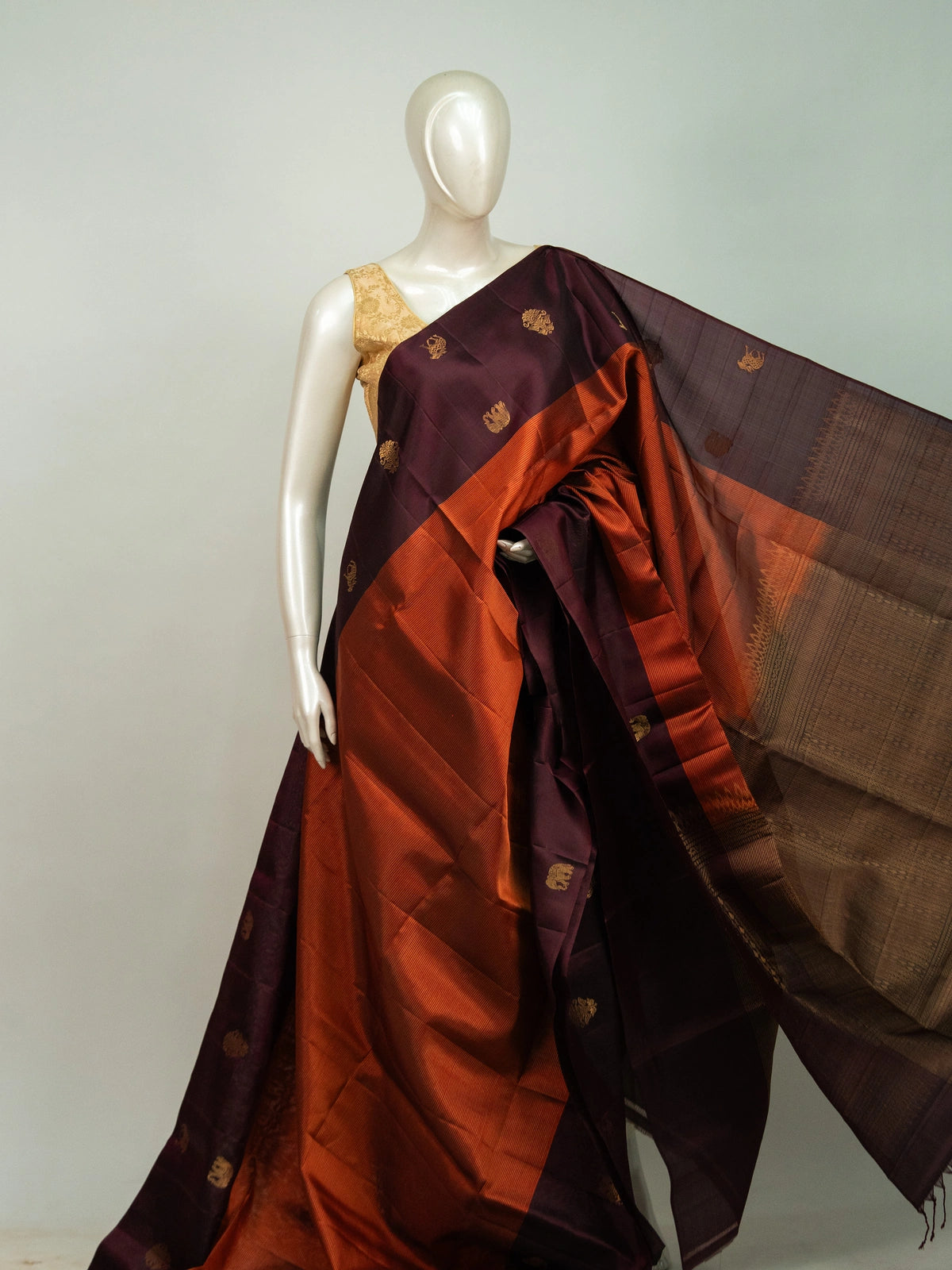 Wine purple pure soft silk saree with rust orange contrast border and gold zari butta motifs