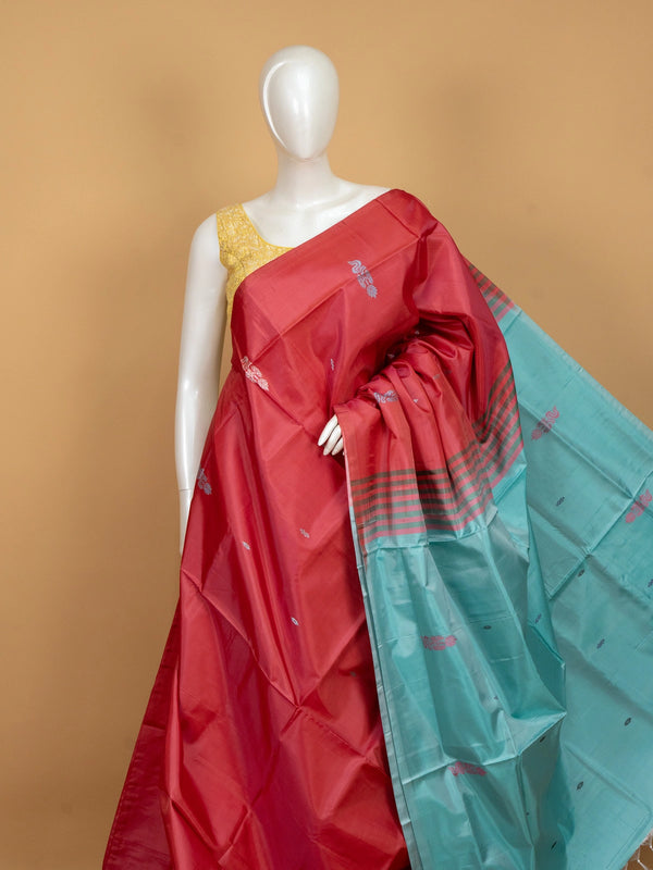 Rani pink banana silk saree with turquoise contrast pallu and woven butta motifs