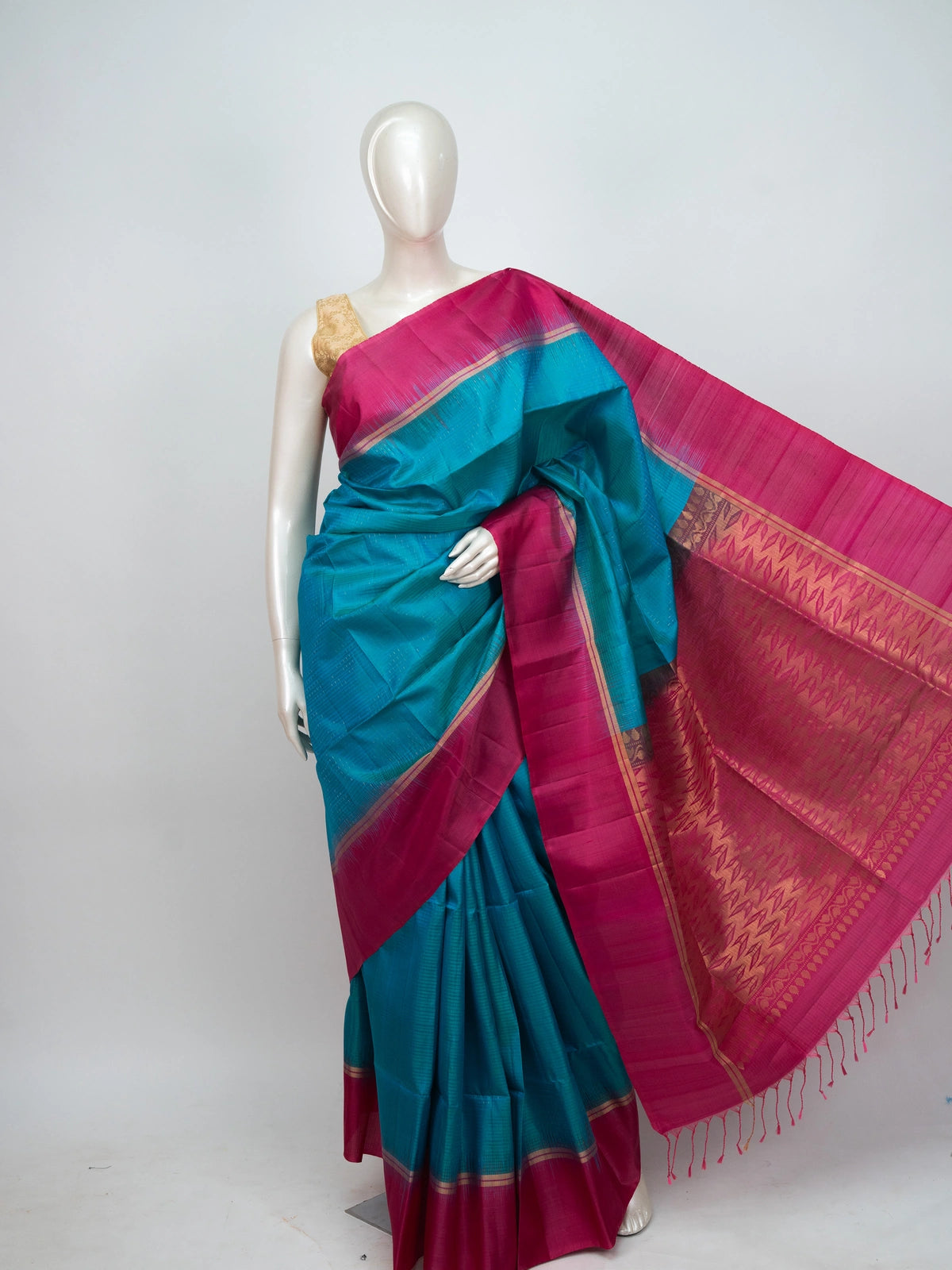Peacock blue soft silk saree with contrast pink gold zari temple border and pallu
