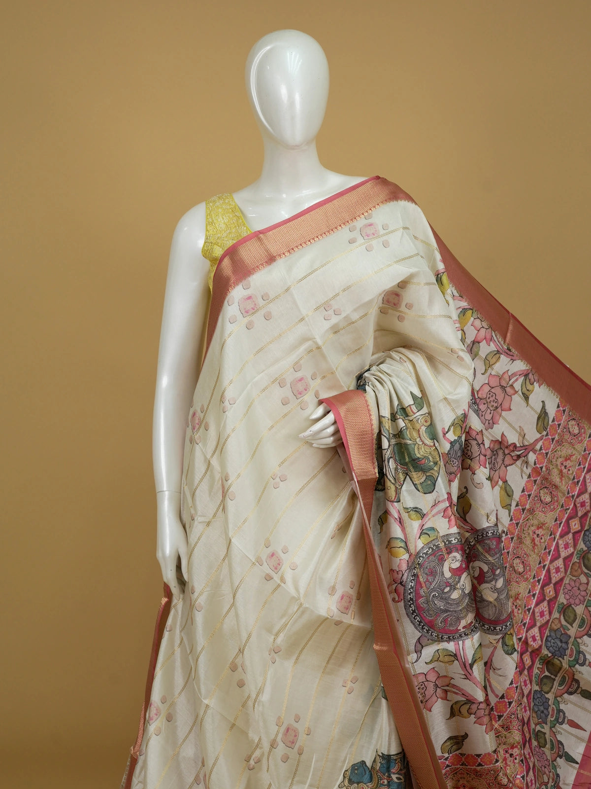 Cream Dola silk saree with pink zari border and Kalamkari peacock-medallion pallu