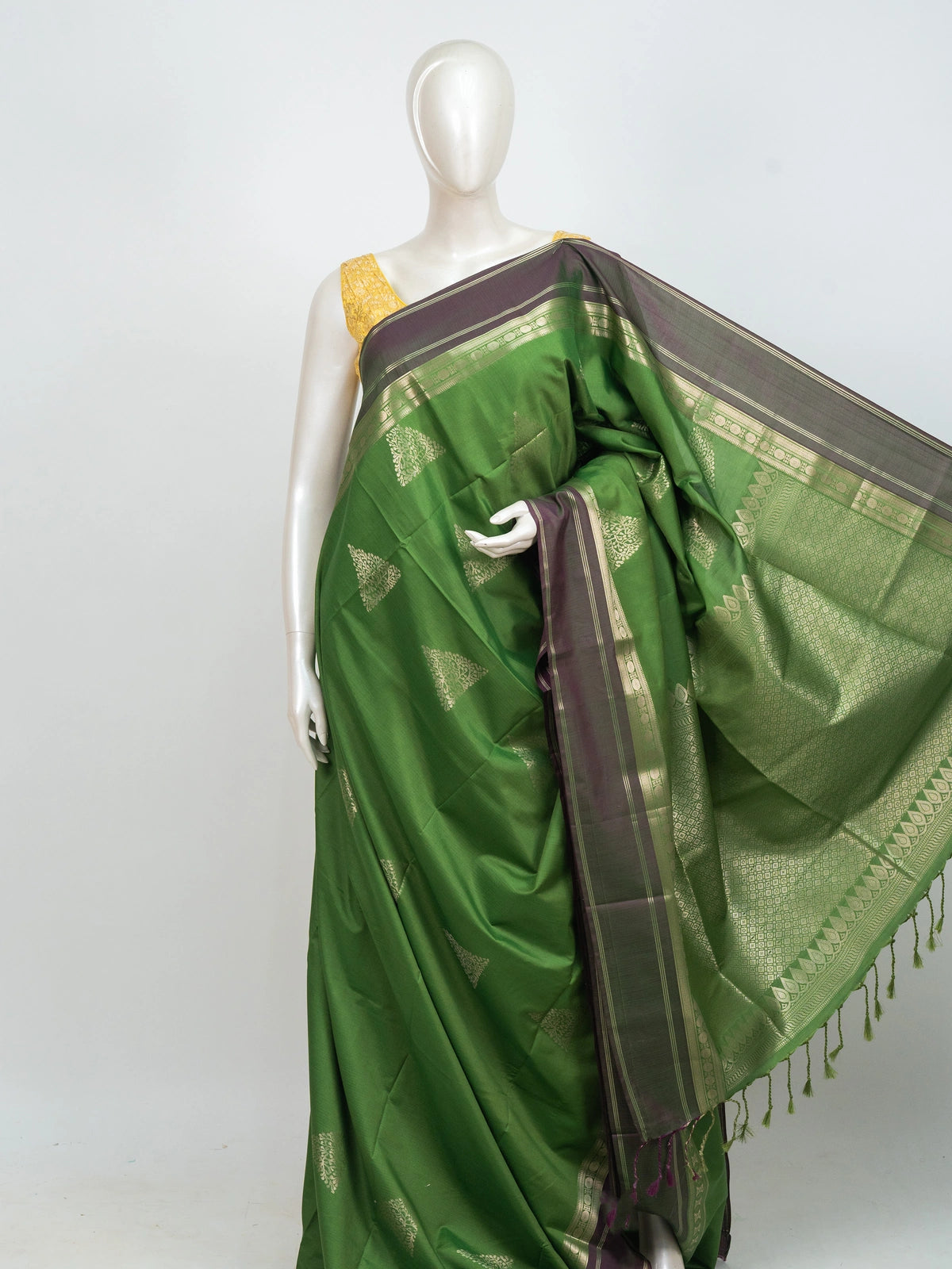 Green Kanchipuram fancy silk saree with contrast mauve zari border and triangular temple zari buttas