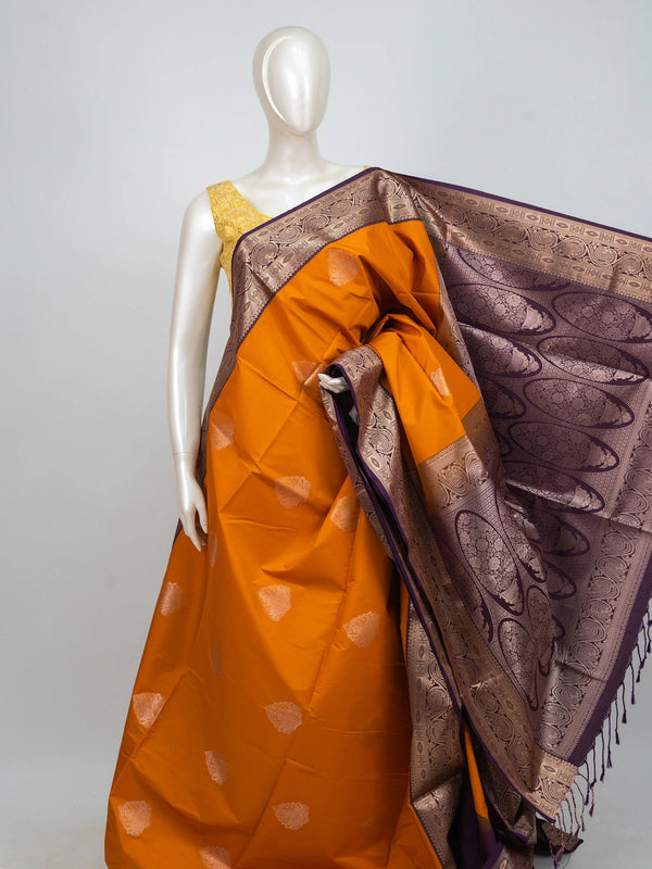 Mustard semi silk saree with contrast purple gold zari border, zari buttas, and ornate woven pallu