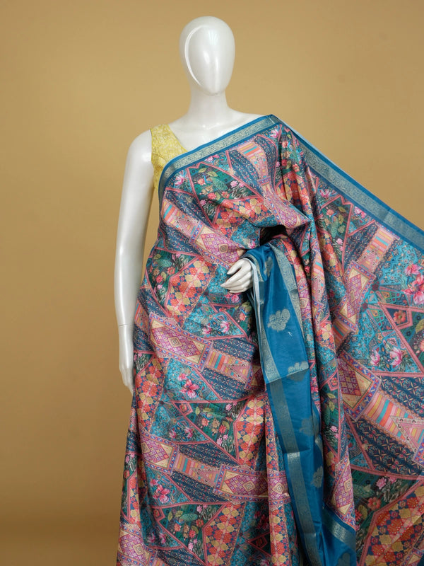 Teal blue and multicolour Dola silk saree with patchwork floral print and silver zari contrast border