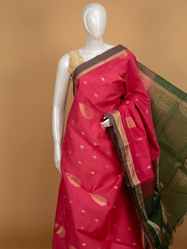 Pink pure silk cotton saree with gold zari buttas and contrast green zari border and pallu