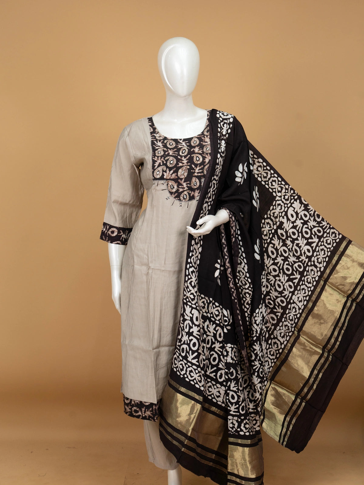 Grey batik cotton A-line kurti set with mirror work yoke and black batik dupatta with gold zari border