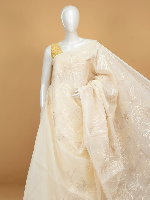 Cream organza designer saree with gold leaf embroidery and scalloped border