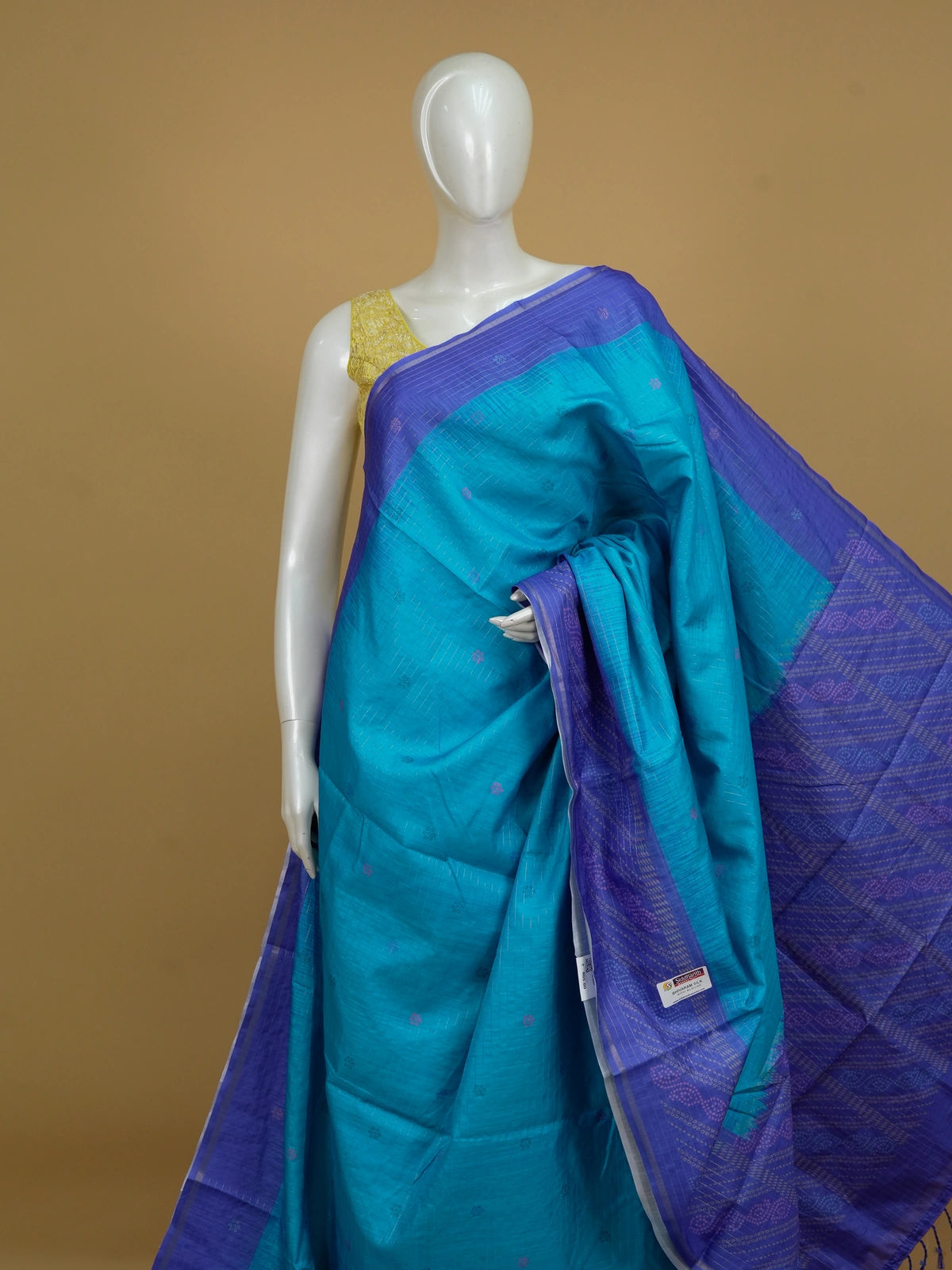 Peacock blue Dola silk saree with contrast violet zari border and bandhani-style pallu