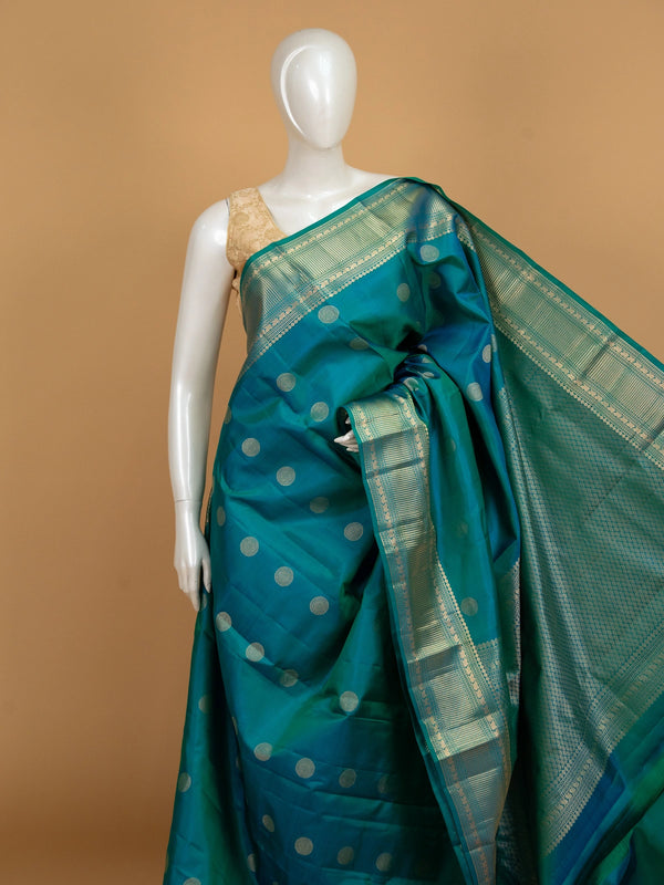 Peacock teal pure Kanchipuram silk saree with gold zari chakra buttas and contrast zari border