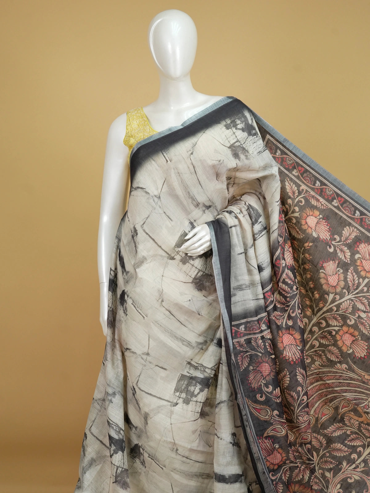 Cream and charcoal grey linen cotton saree with batik-style body print and Kalamkari peacock pallu