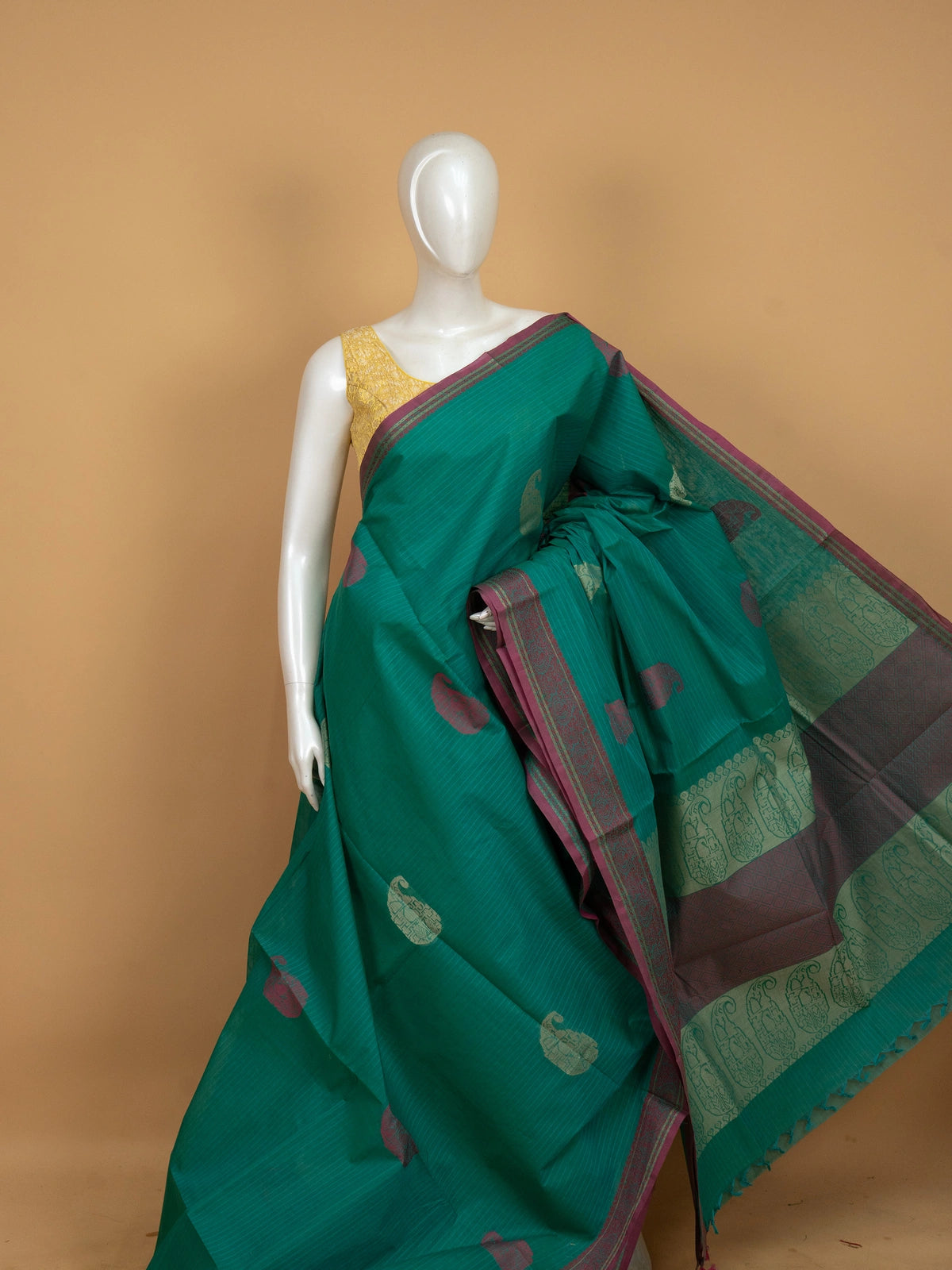 Teal green semi raw silk saree with magenta gold zari paisley border and buttas