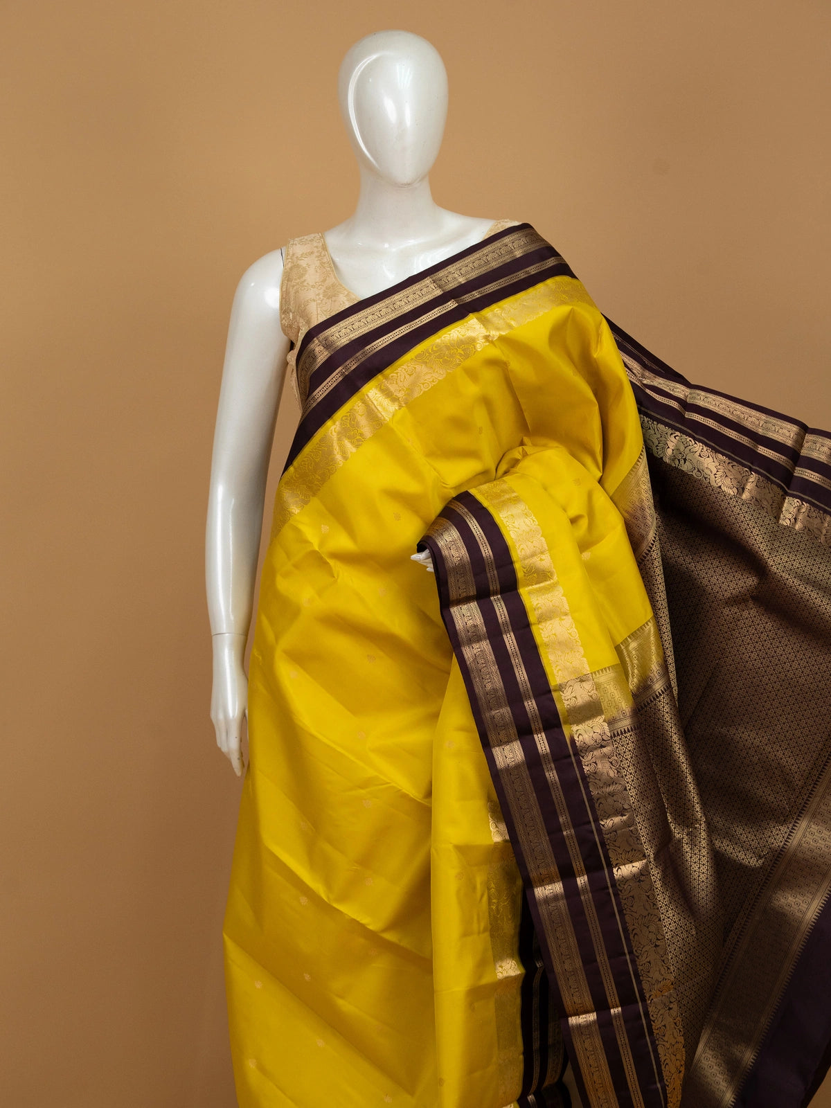 Yellow pure Kanchipuram silk saree with contrast wine border and gold zari brocade pallu