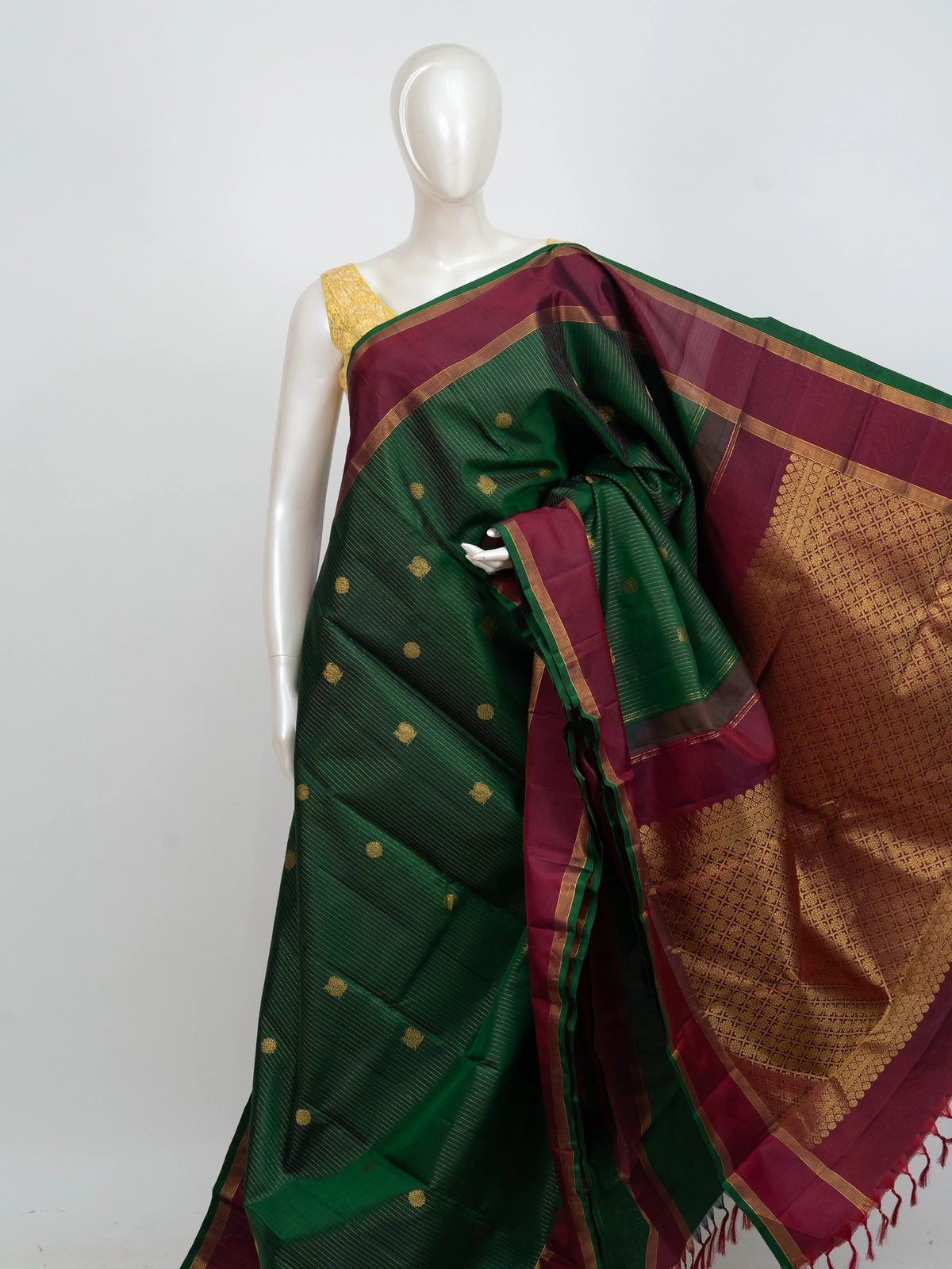 Green pure Kanchipuram silk saree with contrast maroon border and gold zari brocade pallu