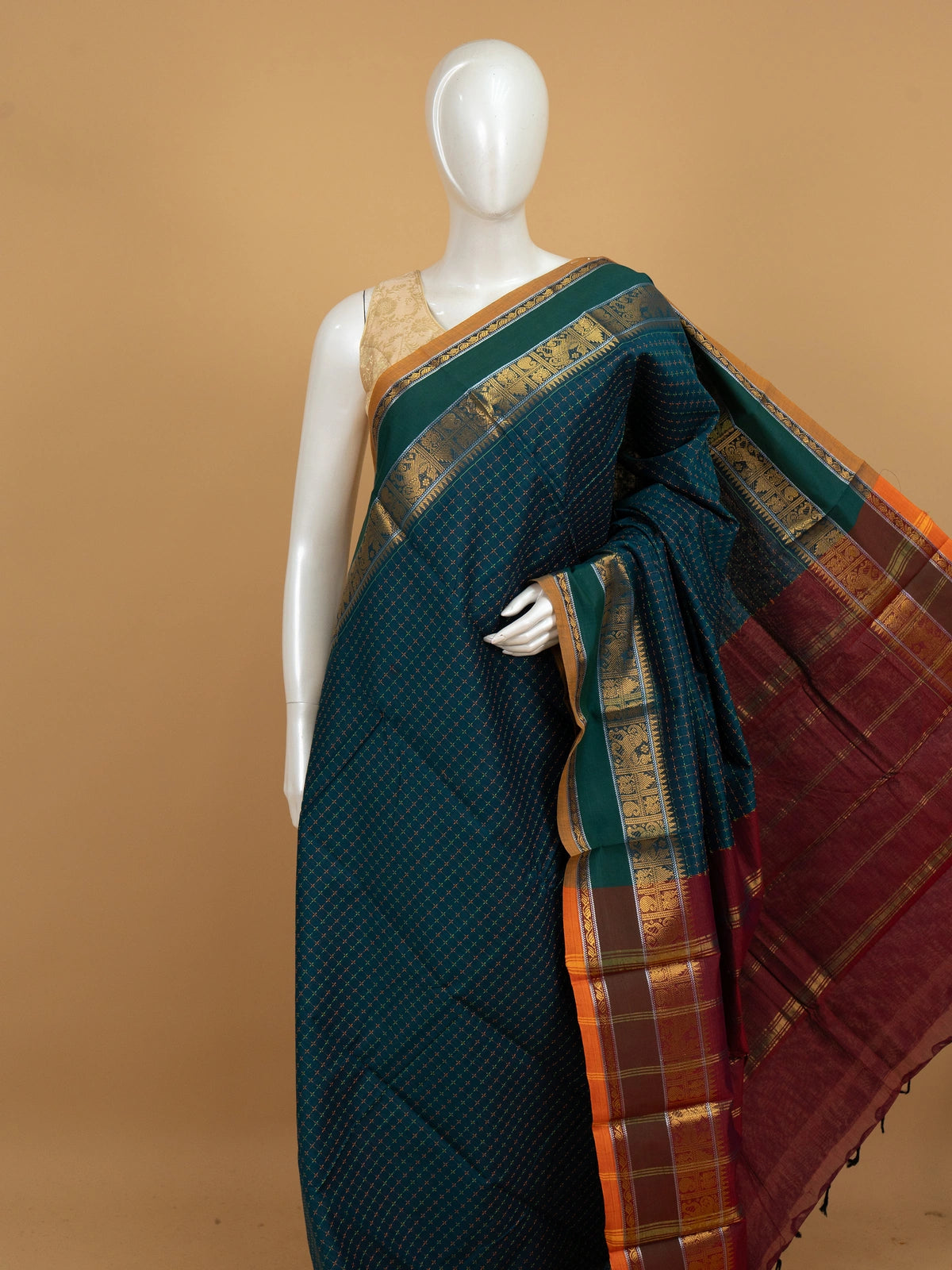 Peacock green Chettinad cotton saree with checked body, gold zari border and maroon striped pallu