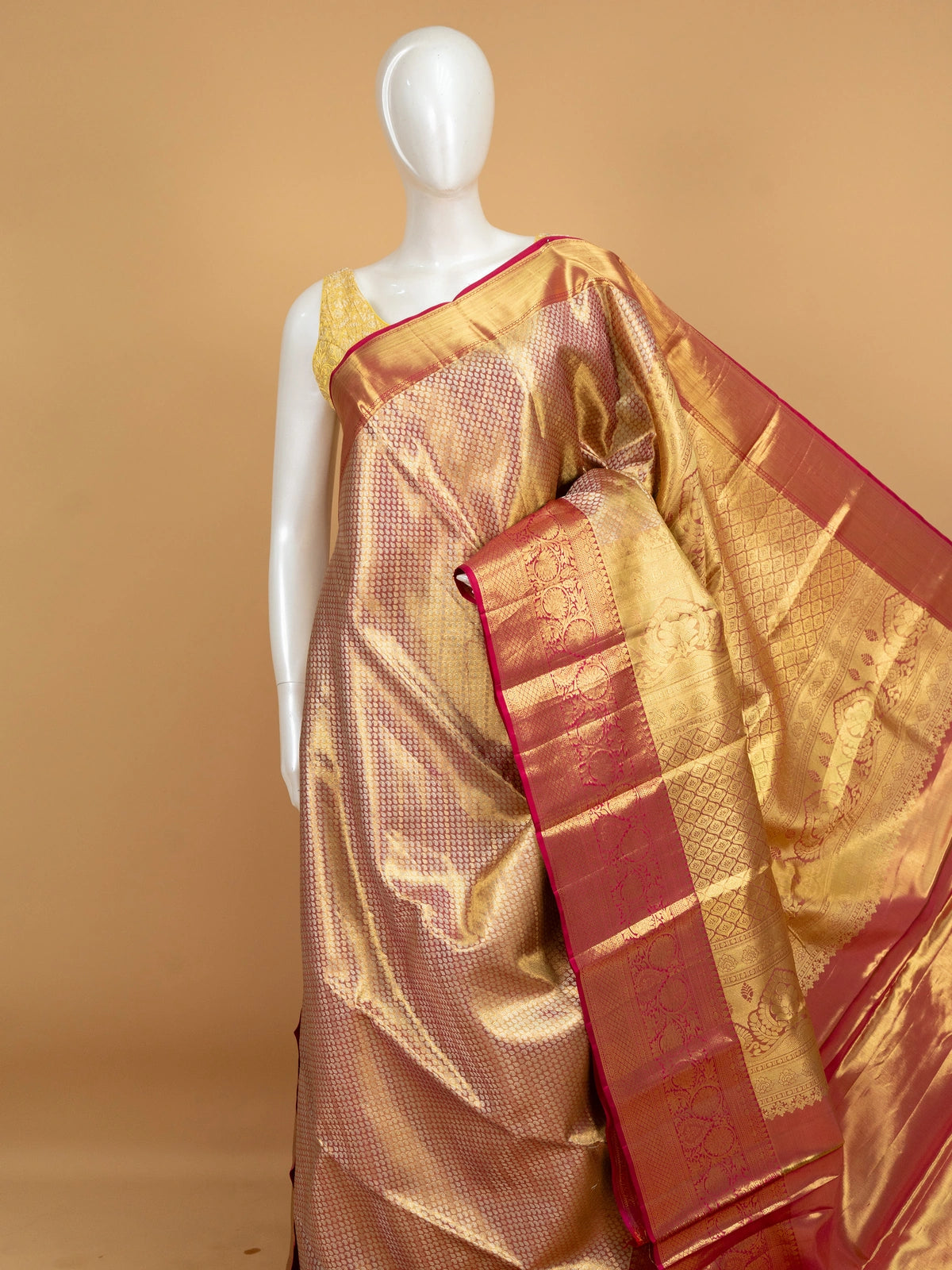 Gold pure Kanchipuram silk saree with contrast pink zari border and ornate woven pallu
