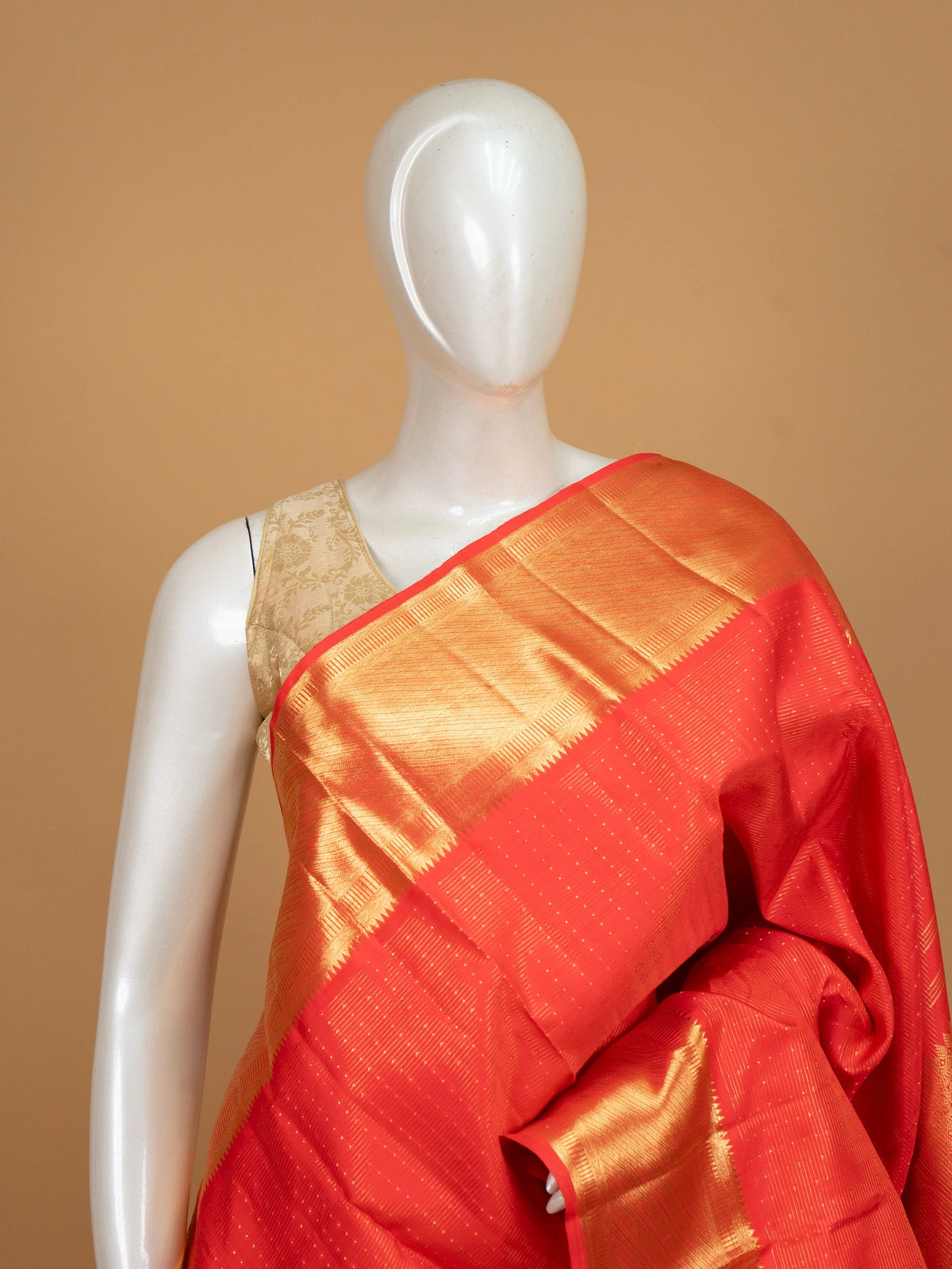 Red pure Kanchipuram silk saree with gold zari buti body, contrast temple-style gold border and paisley zari pallu