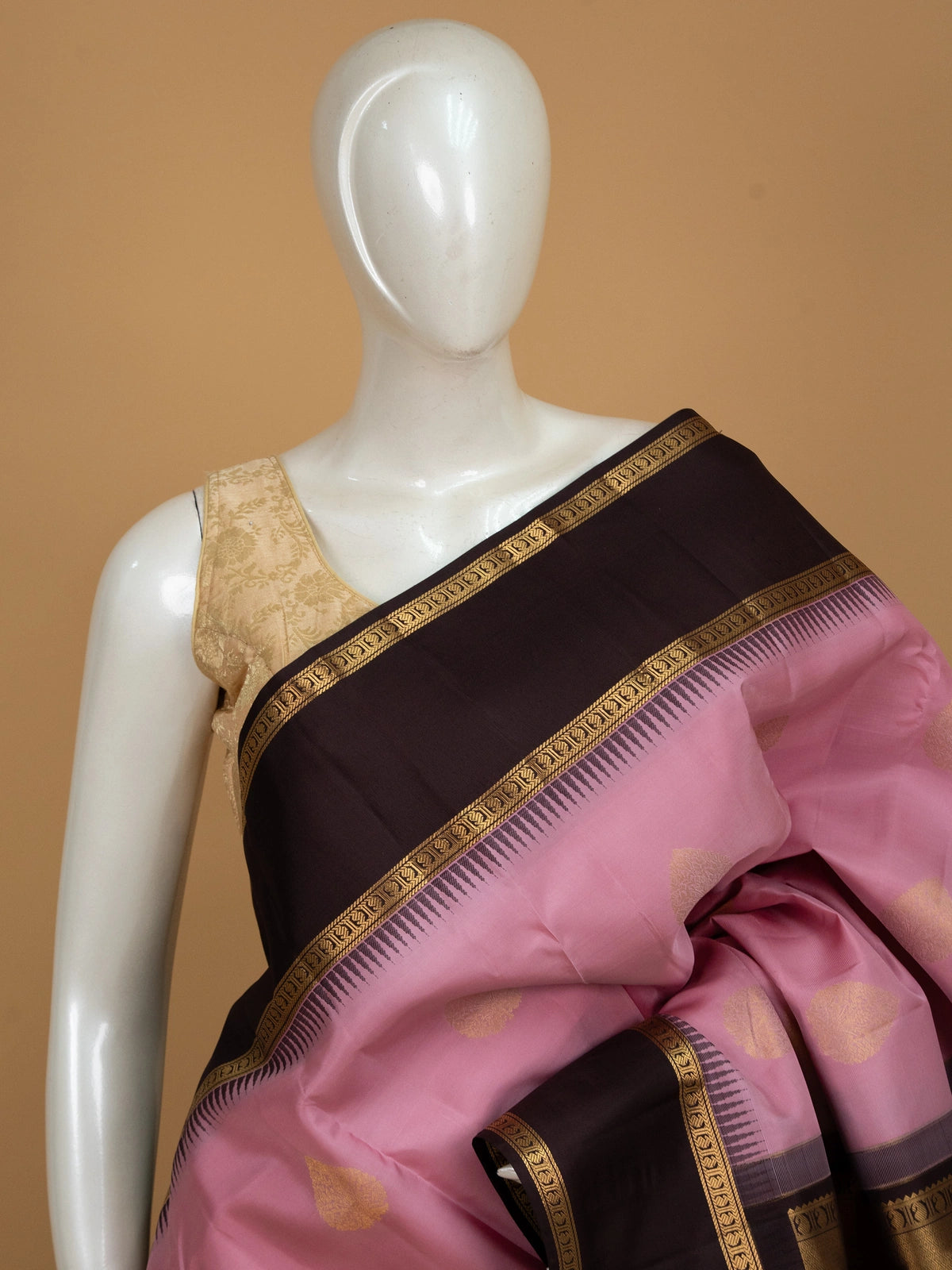 Pink pure Kanchipuram silk saree with contrast dark brown border and gold zari buti motifs