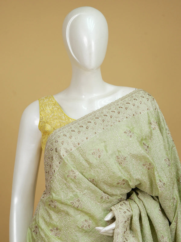 Pista green designer saree with sequin floral embroidery and contrast yellow blouse