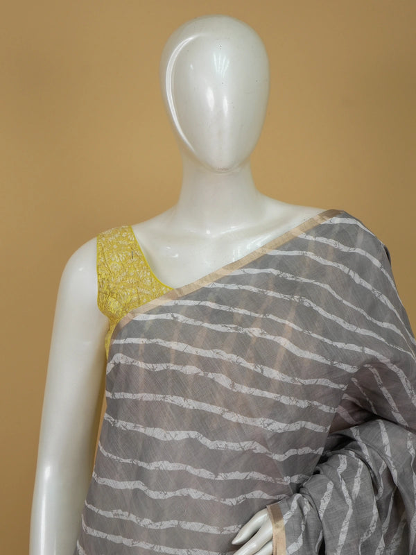 Grey linen cotton saree with white diagonal leheriya stripes, gold zari border and a floral batik pallu