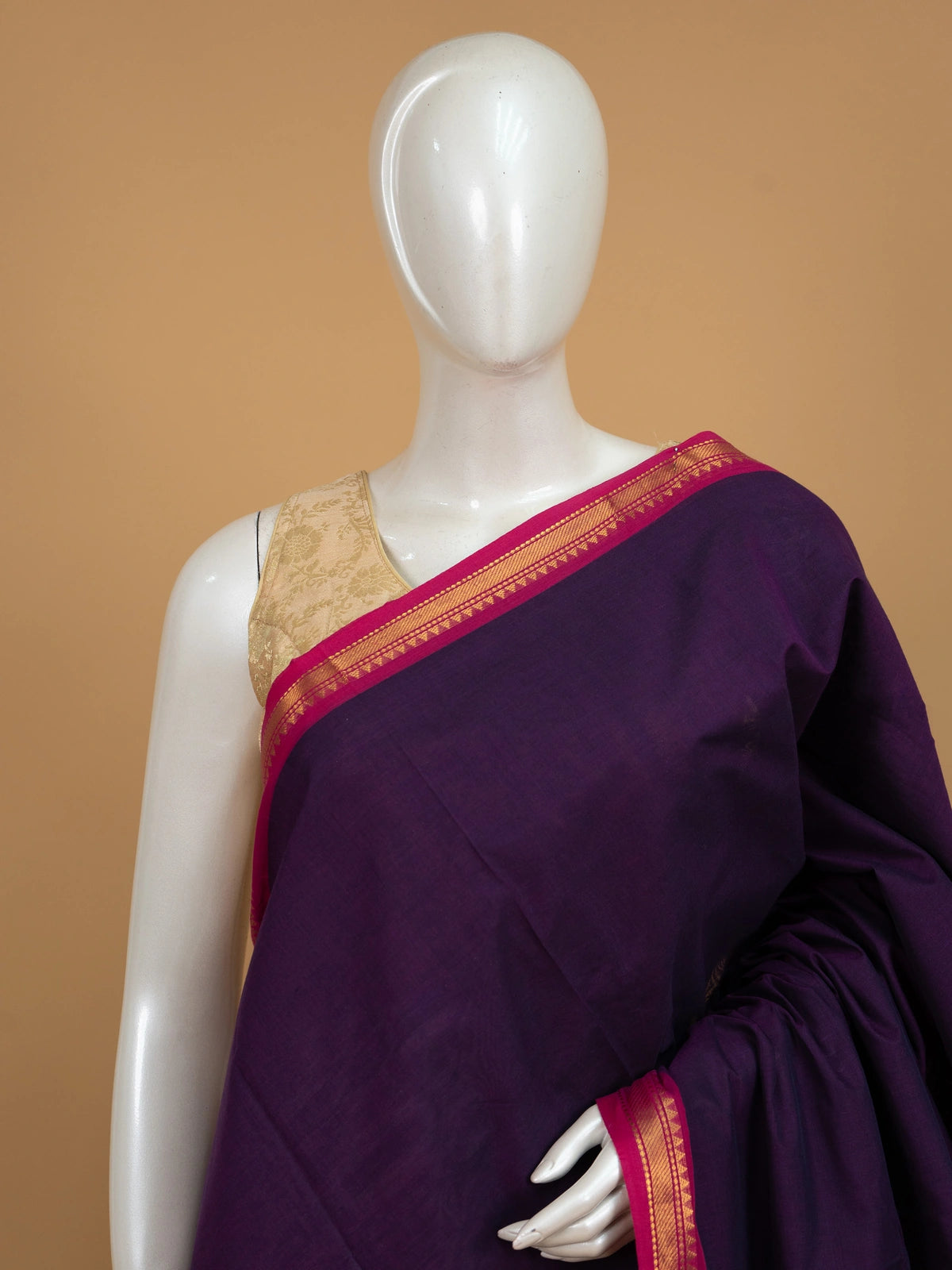Purple Chettinad cotton saree with pink gold zari temple-motif border and blue-striped pallu