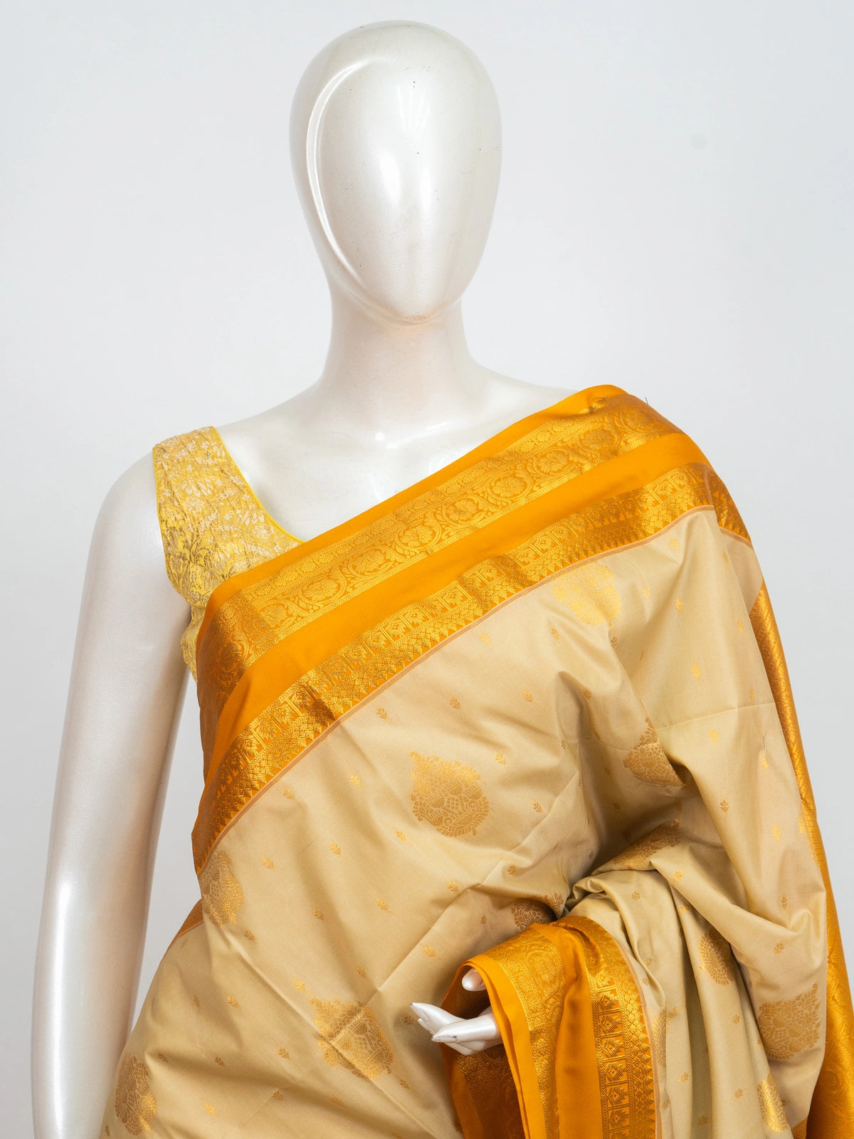 Cream Kanchipuram fancy silk saree with mustard yellow contrast border and gold zari pallu